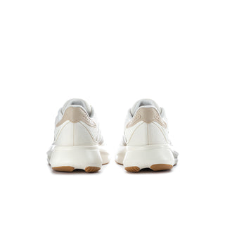 Women's white running shoes with cushioned heel and lace-up back detail
