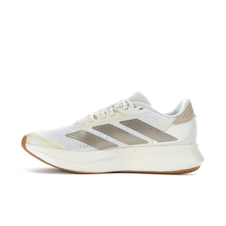Women's white running shoes with metallic gray front panel and lace-up vamp
