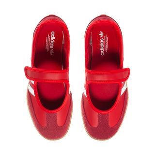 Red adidas sneakers with hook-and-loop strap, showing branded insoles.