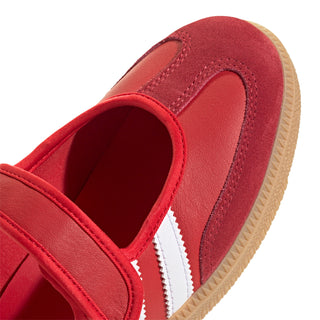 Red adidas sneaker upper with hook-and-loop strap and white stripe detail.