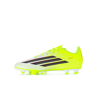 Youth neon yellow soccer cleats with black/red stripes and textured upper, FG studs