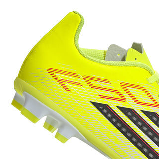Neon yellow youth soccer cleat upper with black-and-red graphic stripes, FG studs
