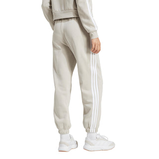 Womens light beige loose track pants with white 3-Stripes and cuffed ankles
