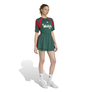 Womens dark green tennis dress with red shoulder panels, white adidas logo, and skirt