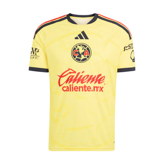 Yellow mens soccer home jersey with navy collar stripes, crest, and Caliente sponsor logo