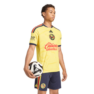 Yellow mens soccer home jersey with navy trim and Caliente sponsor on the front