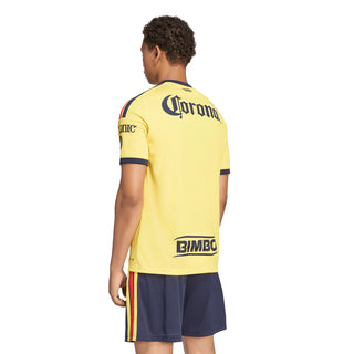 Yellow mens soccer home jersey back view with Corona and Bimbo sponsor logos