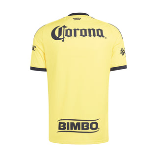 Yellow mens soccer home jersey back with Corona and Bimbo sponsor logos and navy cuffs