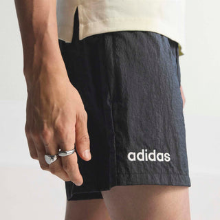 Black athletic shorts with adidas logo on back leg and relaxed fit