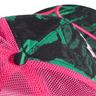Pink mesh back trucker cap with green camo pattern, black top, and pink trim