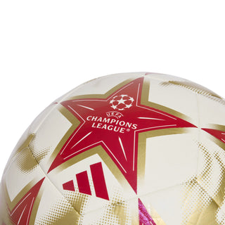 Soccer ball close-up with red star emblem and Champions League text on white panels