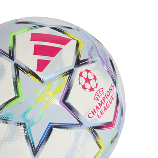 White mini soccer ball close-up with magenta UEFA Champions League emblem and star
