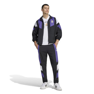 Men's Real Madrid EQT track jacket with purple and white side stripes, worn with pants