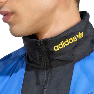 Black track jacket collar with yellow adidas logo and zip front