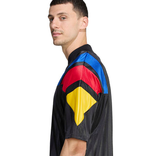 Black soccer jersey sleeve with blue, red, and yellow panel stripe accents