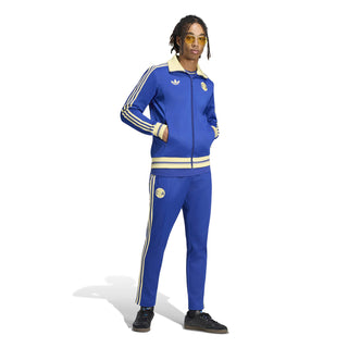 Mens blue track jacket with matching track pants, zip front, and gold side stripes