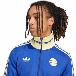 Mens blue track jacket close-up with gold stripe detailing and zip-front collar