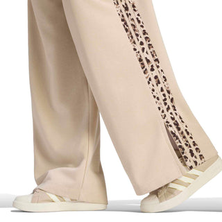 Womens beige wide-leg pants with animal-print side stripe and adidas logo