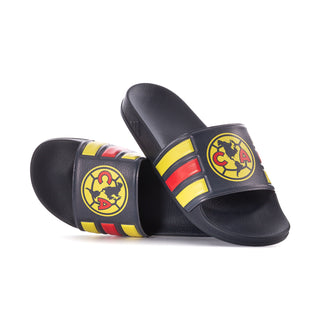 Men's slide sandals with dark navy footbed and circular club crest on striped strap