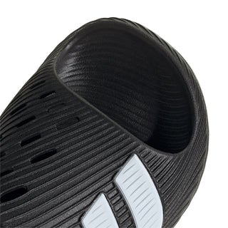 Black slide sandal upper with diagonal ridged texture and white stripe panel
