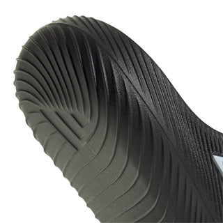 Black slide sandal heel with molded tread pattern and contoured cushioning