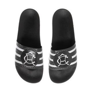 Men's black slide sandals with white striped bands and circular emblem at toe
