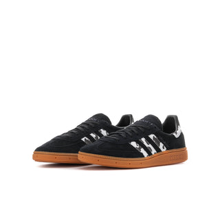 Youth black lace-up handball sneakers with white stripes and gum outsole