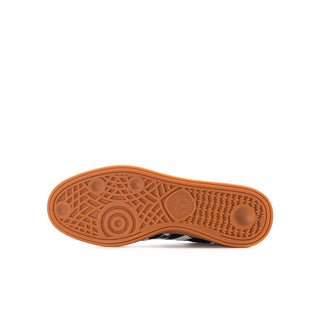 Youth sneaker outsole, gum-orange rubber tread with circular logo detail