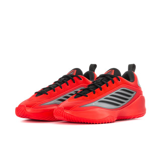 Pair of bright red athletic shoes with black laces and gray performance stripes