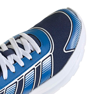 Youth sneaker close-up, blue laces and stripe pattern on navy mesh upper