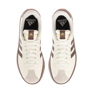 Women’s off-white sneakers, front view with laces and logo labels on tongue and heel