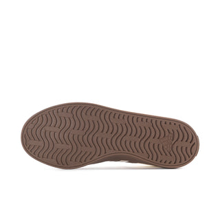 Women’s sneaker outsole in brown with textured tread pattern