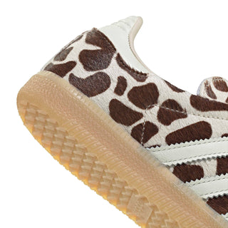 Close-up of women’s adidas sneaker sidewall; gum sole texture and giraffe-print upper