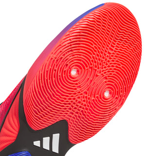 Men's basketball shoes outsole close-up, red traction tread with black heel logo
