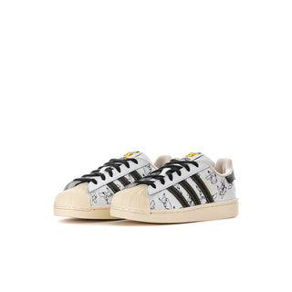 Kids low-top sneakers, side view, white leather with dark stripes and Pikachu cartoon