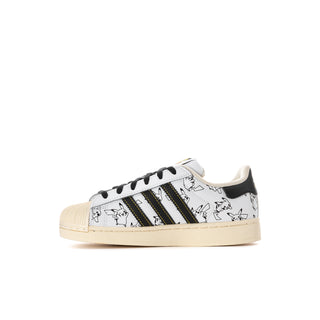 Kids low-top sneakers side profile, white upper with character print and green stripes