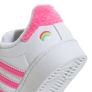 Toddler sneaker close-up of pink fuzzy heel collar and rainbow icon patch