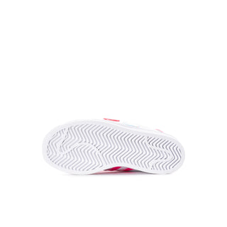 Kids' white sneakers outsole with textured traction pattern and pink side accent
