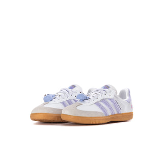 Pair of kids' white low-top sneakers with purple stripes, Care Bears details, gum sole