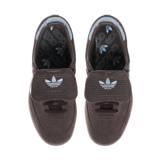 Pair of dark brown suede low-top sneakers with light blue lining and lace