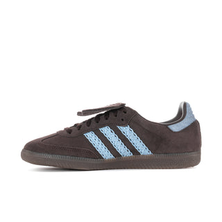 Side view: dark brown suede low sneakers with light blue three stripes and lace