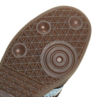 Close-up of gum rubber outsole with circular traction pods and textured tread