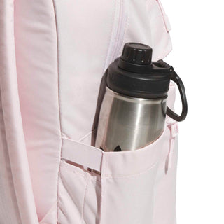 Light pink double-stacked backpack with side bottle pocket holding a stainless steel water bottle.