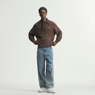 Mens light blue denim pants featuring side stripe seams and wide straight leg