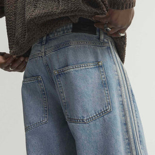 Close-up of mens light blue denim pants back with yoke and patch pockets