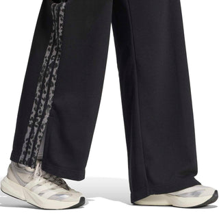 Black wide-leg track pants with animal-print side stripe and open hem