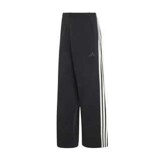 Women's black track pants with off-white 3-stripe side panels