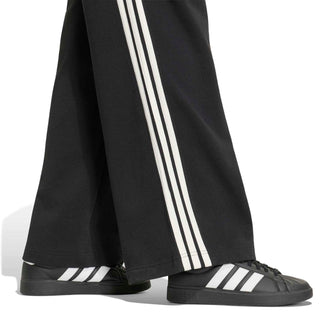 Women's black pants with off-white triple stripe down the outer leg