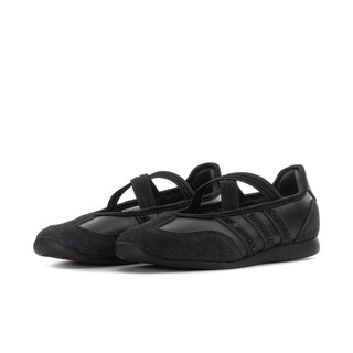 Women's black Mary Jane flats with crisscross elastic strap and low rubber sole