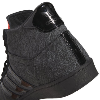 Men's black high-top sneaker with adidas heel patch and crinkled leather texture